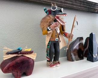 Traditional Hopi katchina doll statues, including coyote and eagle