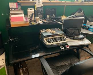 Two tiered dark glass desk