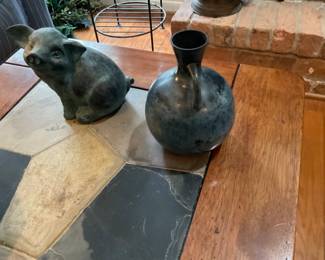 Vintage cast iron sitting pig and vase