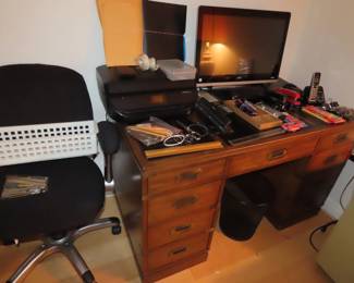 Sligh desk, ergonomic desk chair.