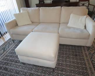 Faux suede sofa, loveseat and footstool.