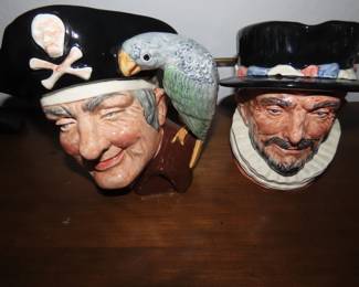 Two Royal Doulton character jugs. Beefeater and Long John Silver.