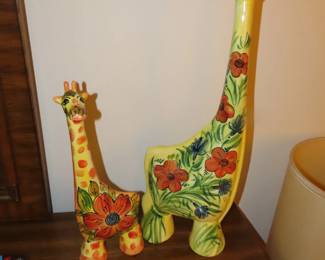 Two ceramic giraffes.