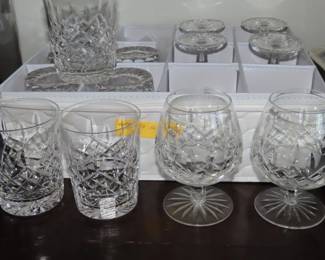 Waterford crystal high ball tumblers and brandy snifters.