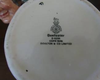 Two Royal Doulton character jugs. Beefeater and Long John Silver.