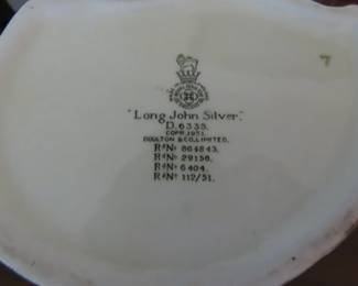 Two Royal Doulton character jugs. Beefeater and Long John Silver.