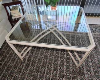 Glass and powder coated metal coffee table.