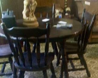 Round table and chairs, table has leaves