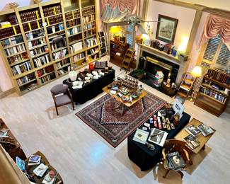 LARGE LIVING ROOM WITH BOOKSHELVES PACKED FULL ON BOTH SIDES!  ROOMS STUFFED WITH BOOKS!