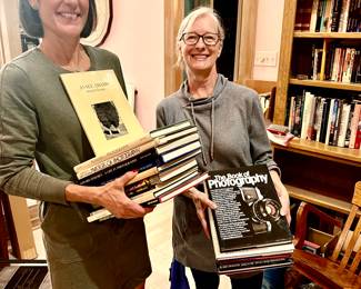 Dawn and Lisa with lots of books on photography in the upstairs craft room