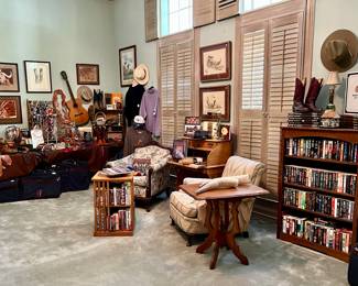LARGE MASTER BEDROOM WITH BOOKS, COWBOY HATS, BOOTS, AND BELTS!  LOTS OF BOOKS ON TEXANA.
