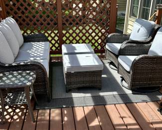 6 pc Outdoor Wicker Patio Set with Cushions.  Look at this current contemporary set at the perfect time before Spring and Summer.  It's rare to find this type of patio furniture that homeowners are selling.  3 Cushion Sofa,  2 Ottomans, 2 Glider/Rockers and 1 Side Table.  