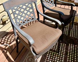 Take a look at this very unique Patio Table and Chairs.  Made from Aluminum Cast with Lattice Woven Style in the Chairs and Table.  The design features a Copper Element to the Chairs, Table and Umbrella Stand. The Table is 72" Long and 41" Wide.  There are 2 Swivel Rockers and 4 Dining Chairs. The cushions are in great condition by Sunbrella and  the Umbrella is from Garden Treasures and in Rectangular in shape . Purchased from Great Escape.