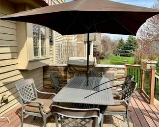 Take a look at this very unique Patio Table and Chairs.  Made from Aluminum Cast with Lattice Woven Style in the Chairs and Table.  The design features a Copper Element to the Chairs, Table and Umbrella Stand. The Table is 72" Long and 41" Wide.  There are 2 Swivel Rockers and 4 Dining Chairs. The cushions are in great condition by Sunbrella and  the Umbrella is from Garden Treasures and in Rectangular in shape . Purchased from Great Escape.