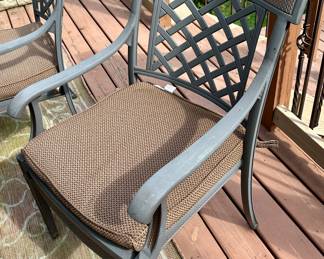 Take a look at this very unique Patio Table and Chairs.  Made from Aluminum Cast with Lattice Woven Style in the Chairs and Table.  The design features a Copper Element to the Chairs, Table and Umbrella Stand. The Table is 72" Long and 41" Wide.  There are 2 Swivel Rockers and 4 Dining Chairs. The cushions are in great condition by Sunbrella and  the Umbrella is from Garden Treasures and in Rectangular in shape . Purchased from Great Escape.