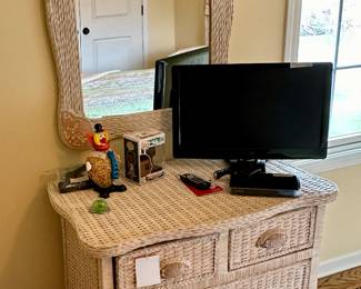 This is very nice Wicker Bedroom Set including Bedframe and Mattress/Boxspring, 4 Drawer Dresser and Mirror, Wicker Accent Chair and Wicker Nightstand