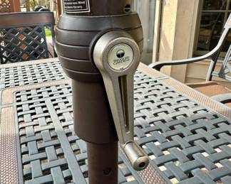 Take a look at this very unique Patio Table and Chairs.  Made from Aluminum Cast with Lattice Woven Style in the Chairs and Table.  The design features a Copper Element to the Chairs, Table and Umbrella Stand. The Table is 72" Long and 41" Wide.  There are 2 Swivel Rockers and 4 Dining Chairs. The cushions are in great condition by Sunbrella and  the Umbrella is from Garden Treasures and in Rectangular in shape . Purchased from Great Escape.