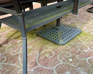 Take a look at this very unique Patio Table and Chairs.  Made from Aluminum Cast with Lattice Woven Style in the Chairs and Table.  The design features a Copper Element to the Chairs, Table and Umbrella Stand. The Table is 72" Long and 41" Wide.  There are 2 Swivel Rockers and 4 Dining Chairs. The cushions are in great condition by Sunbrella and  the Umbrella is from Garden Treasures and in Rectangular in shape . Purchased from Great Escape.