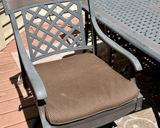 Take a look at this very unique Patio Table and Chairs.  Made from Aluminum Cast with Lattice Woven Style in the Chairs and Table.  The design features a Copper Element to the Chairs, Table and Umbrella Stand. The Table is 72" Long and 41" Wide.  There are 2 Swivel Rockers and 4 Dining Chairs. The cushions are in great condition by Sunbrella and  the Umbrella is from Garden Treasures and in Rectangular in shape . Purchased from Great Escape.