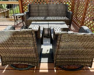 6 pc Outdoor Wicker Patio Set with Cushions.  Look at this current contemporary set at the perfect time before Spring and Summer.  It's rare to find this type of patio furniture that homeowners are selling.  3 Cushion Sofa,  2 Ottomans, 2 Glider/Rockers and 1 Side Table.  Cushions are shown in next photo