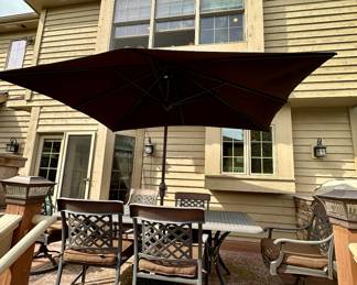 Take a look at this very unique Patio Table and Chairs.  Made from Aluminum Cast with Lattice Woven Style in the Chairs and Table.  The design features a Copper Element to the Chairs, Table and Umbrella Stand. The Table is 72" Long and 41" Wide.  There are 2 Swivel Rockers and 4 Dining Chairs. The cushions are in great condition by Sunbrella and  the Umbrella is from Garden Treasures and in Rectangular in shape . Purchased from Great Escape.