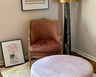 Great looking Vignette with Blush Pink Ottoman, Vintage Highland House Accent Chair, Yves St. Laurent, Chanel, Gucci, Louis Vuitton Framed Print, Mirrored Glass Mosaic Floor Lamp, Area Rug and Floral Print