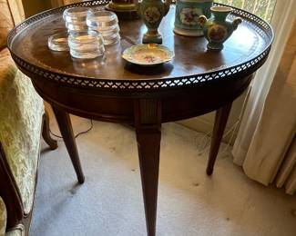 Mid 20th C. Mahogany Side Table.  Features a leather top with brass gallery on tapered legs. 