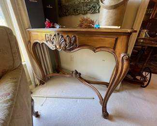 A nice vintage French Provincial Console Table.  Fruitwood with a carved shell and feather motif, raise on cabriole legs.  