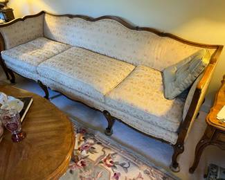 A very fun down filled vintage French Provincial Sofa.  Features a fruitwood frame with tapestry style vintage upholstery.  Bearing its original label from a high style Miami furniture store. 
