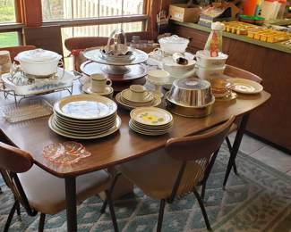 Vintage stoneware dishes, wood and metal lazy susans and this fabulous Mid Century Modern table with 8 chairs
