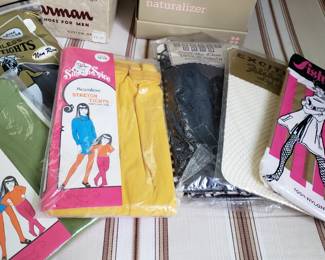 Vintage womens and girls new in package hosiery. Tights, thigh highs, stocking, panty hose and a bunch of fish nets