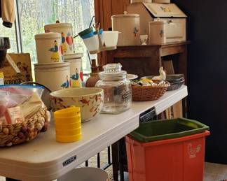 Hand painted vintage cannister sets w/Bakelite handles and many more great vintage kitchenware. The basket on the left has a bunch of super cute vintage cake toppers