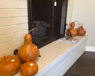 Decorative gourds and cute fireplace screen