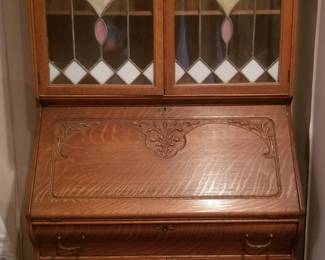 Stunning drop front secretary with stained glass upper cabinet. Amazing condition! So much incredible detail. 