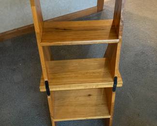 Wooden chair unfolded into a display ladder