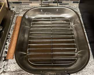 K31 - $100. ALL CLAD Stainless Steel Roasting Pan with rack. 