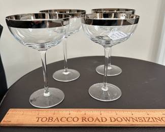 K46 - $25. Set of 4 Champagne Glasses. Silver Band. 