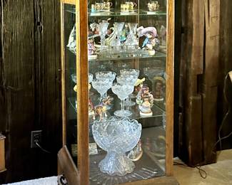 Oak display case ($450) cut glass stemware and pedestal bowl, porcelain cups and saucers.