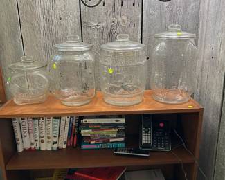 Glass Planters Peanut Jars ($50-100). Teak 1980s bookshelf ($100).