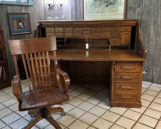 Oak Rolltop Desk with Raised Panels ($950), Oak Office Chair ($150)