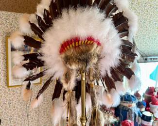 A reproduction "Golden Eagle War Bonnet" with coyote fur made by Comanche Gap. $100