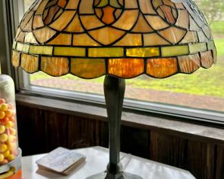 Early 20th century American stained and leaded glass table lamp. $50