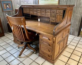 Oak rolltop desk ($950), chair ($150)