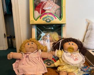 Early 1980's Cabbage Patch Dolls.  Three in Original boxes with adoption papers.  Boy not shown in picture.