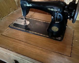 Vintage Sewing Machine with cabinet.