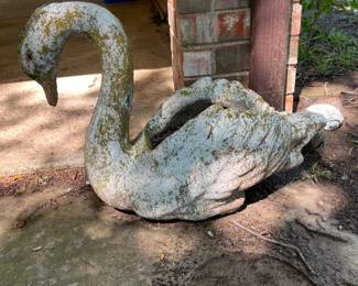 Two Heavy Cement Swans, one has some damage.
