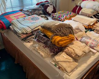 Many handmade quilts, crochet, embroidery, needlepoint items.  Lots of rug hooking wool and rug hooking accessories.