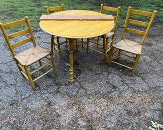 Round painted table with 4 chairs and extra leaf.