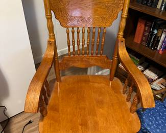Elegant pressed back wood arm chair