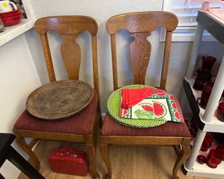 Two dining chairs of the set of six show great wood design